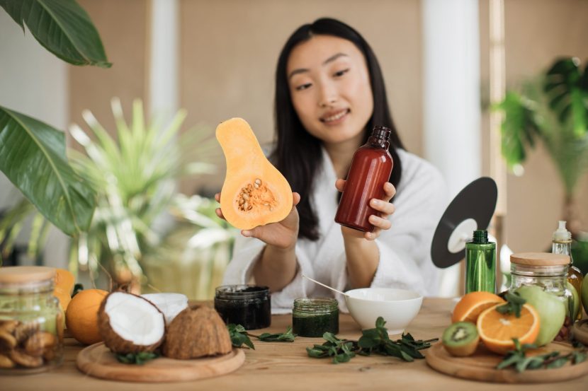 beautiful-healthy-asian-woman-holding-pumpkin-and-2024-12-13-04-27-16-utc